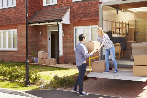Furniture removals team handling large household items in Sutton