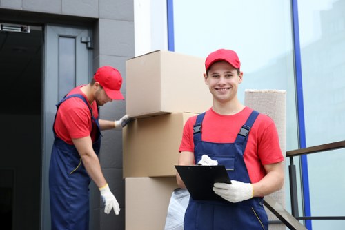 Removal team preparing household items for a scheduled move
