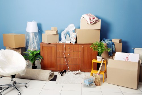 Removal team preparing boxes for a house move in Sutton