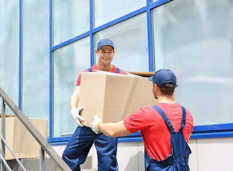 Packed office boxes and labelled equipment ready for a Sutton business move