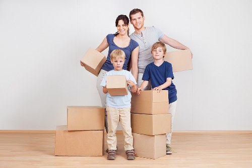 Removal company pricing page with moving van and boxes in Sutton