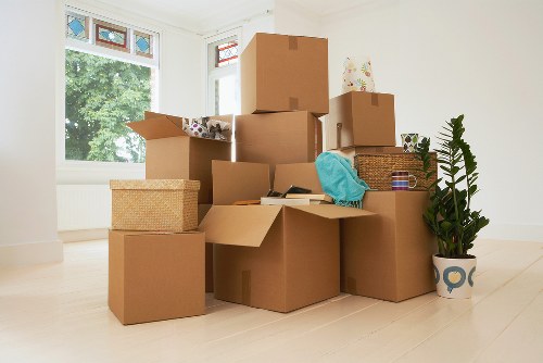 Removals crew loading furniture into a moving van