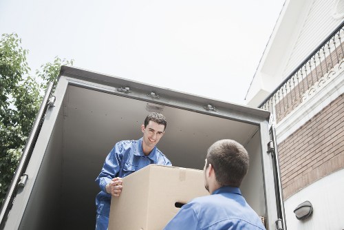 Local moving team loading furniture into a van