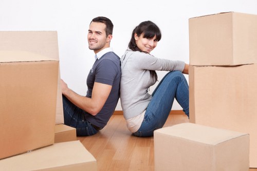 Staff using safe lifting techniques during a house move