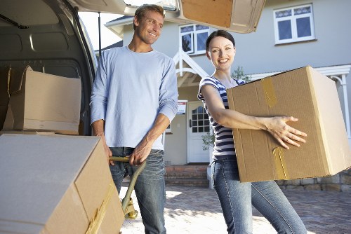Packed boxes and protected furniture ready for flat removals in Sutton